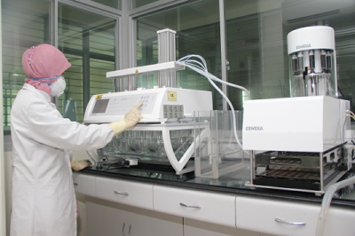 Sanbe Farma researcher at laboratory testing equipment
